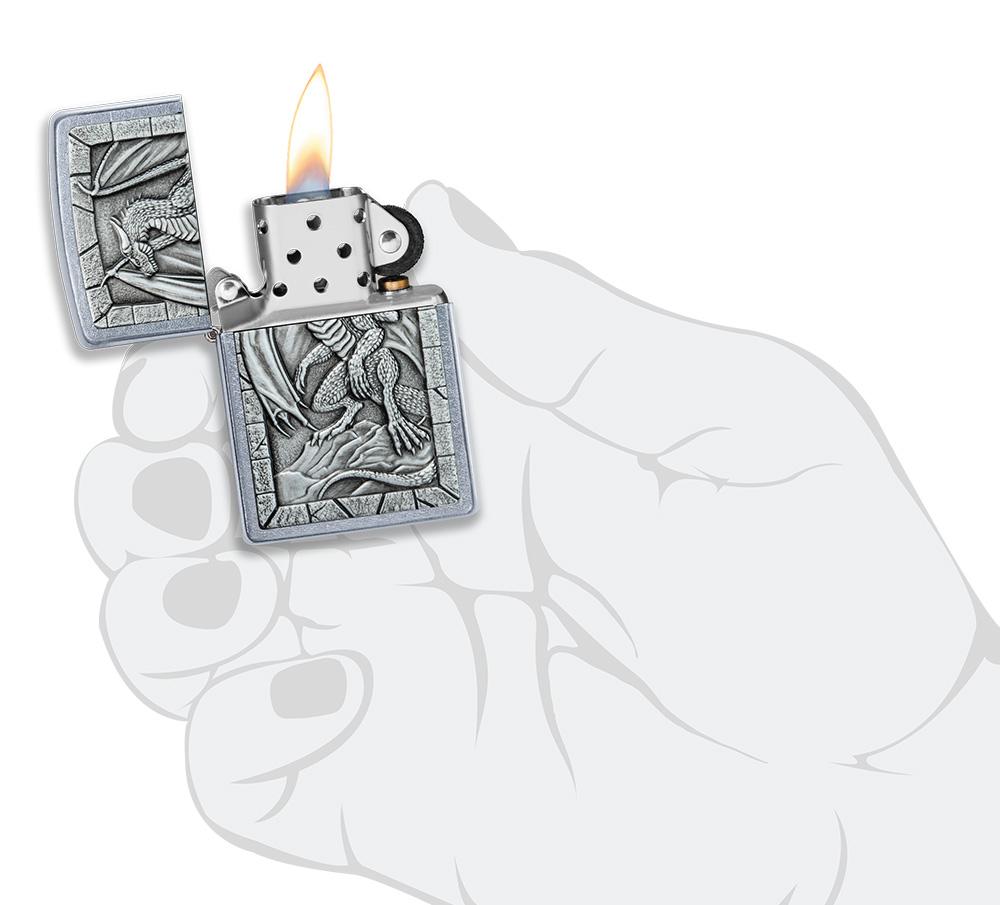 Dragon Emblem Design Street Chrome™ Windproof Lighter lit in hand