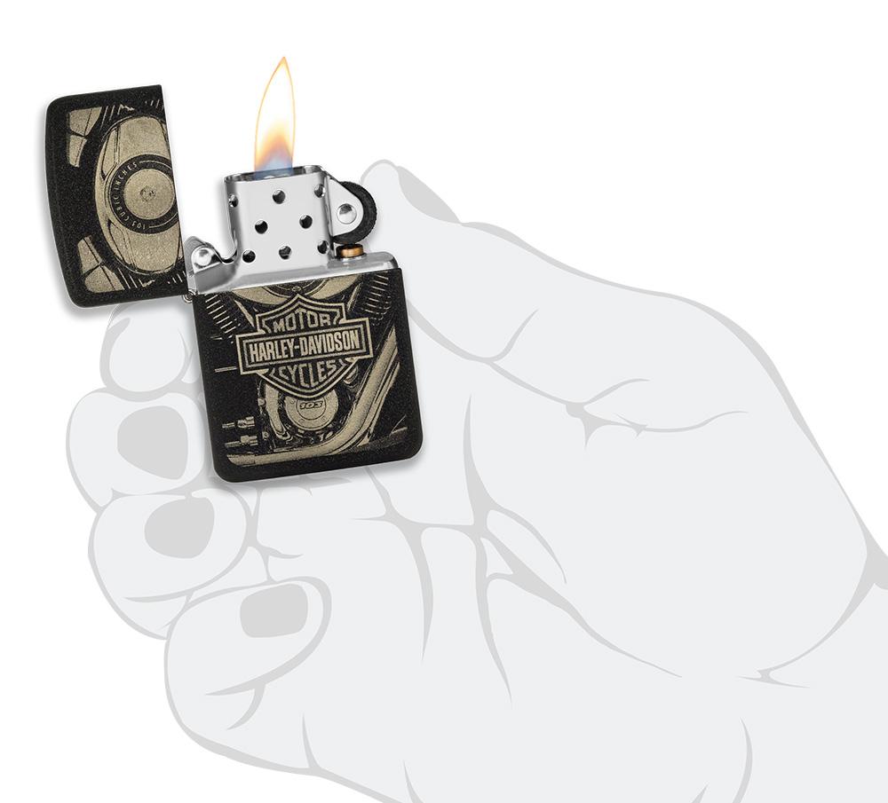 Harley-Davidson® 1941 Replica Black Crackle Windproof Lighter lit in hand