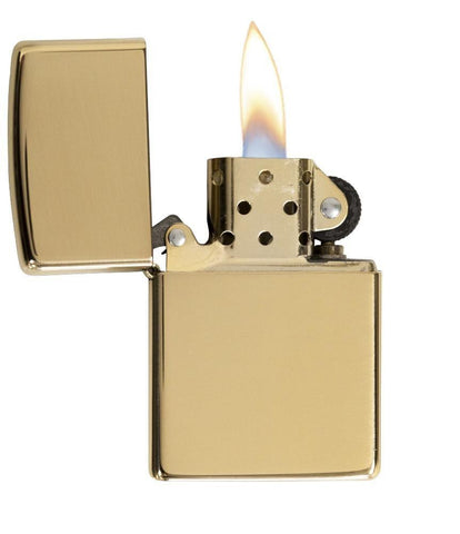 Armor® High Polish Brass Windproof Lighter with its lid open and lit