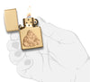 Laughing Buddha Emblem High Polish Brass Windproof Lighter in hand