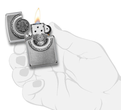 Harley-Davidson® Engine Surprise Emblem Street Chrome Lighter lit in hand