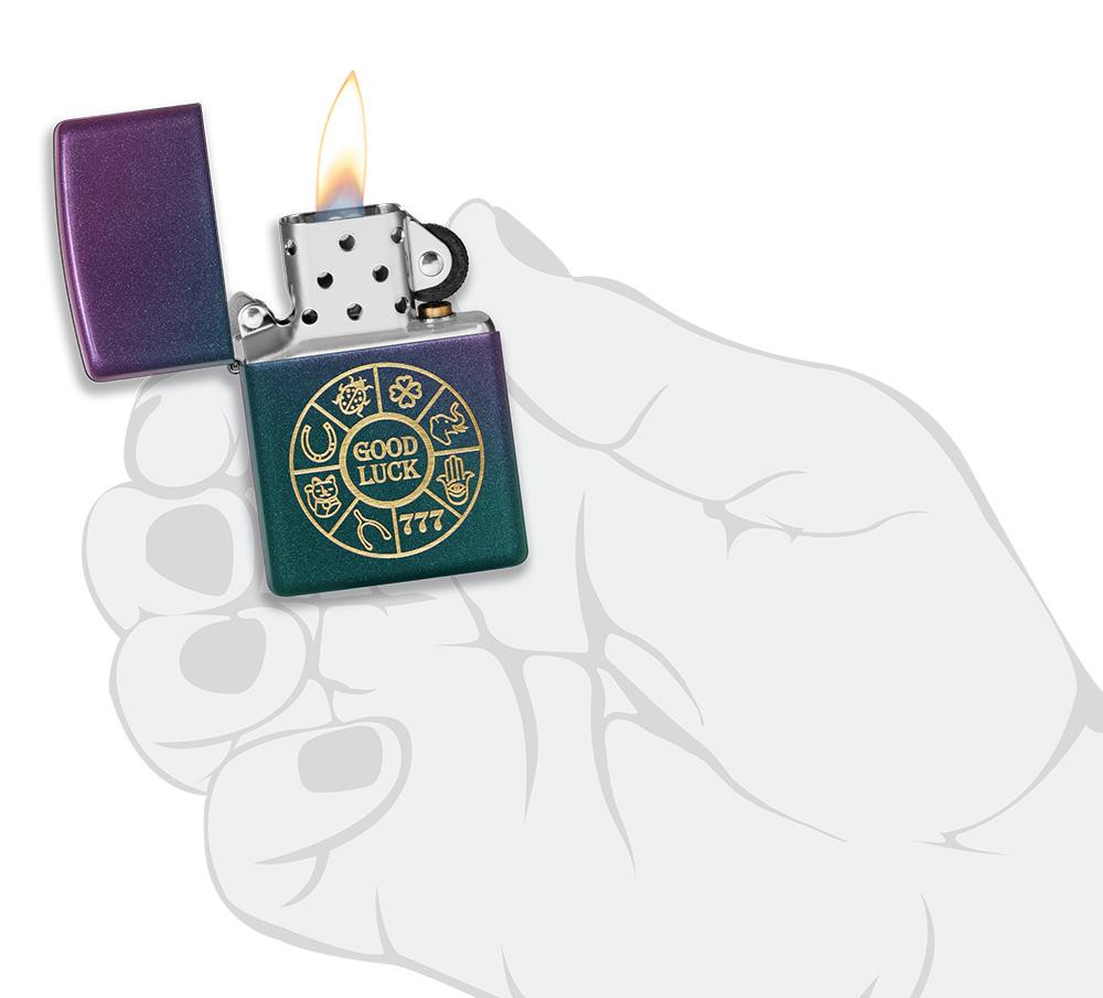 Lucky Symbols Design Iridescent Windproof Lighter lit in hand