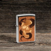 Lifestyle Image of WOODCHUCK USA Skull & Snake Windproof Lighter